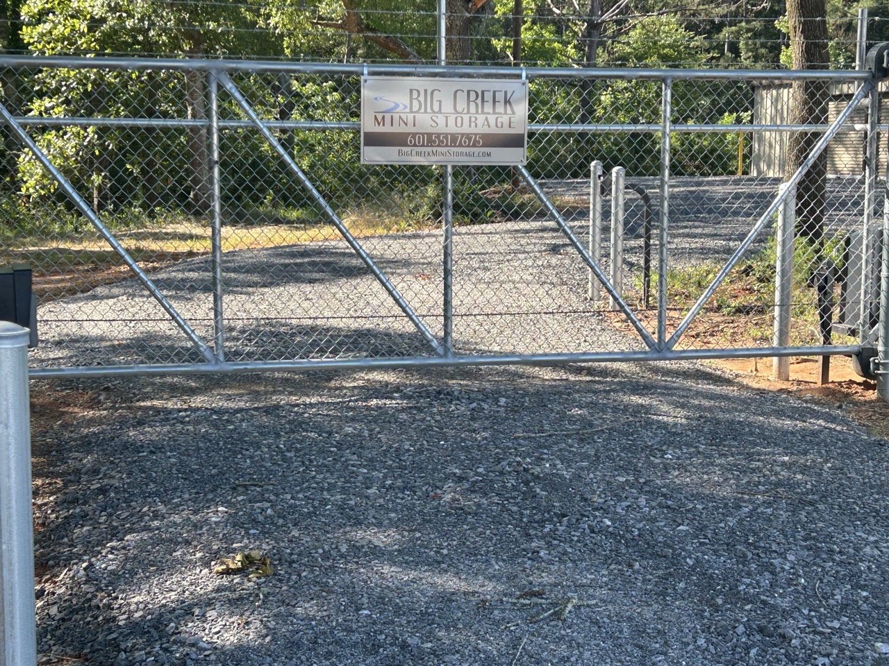 Gated entrance with the Big Creek Mini Storage sign