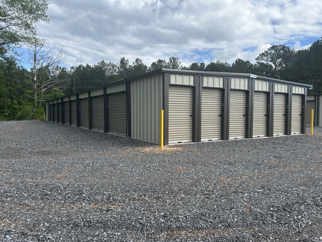 Rows of drive-up storage units with roll-up doors at Big Creek Mini Storage