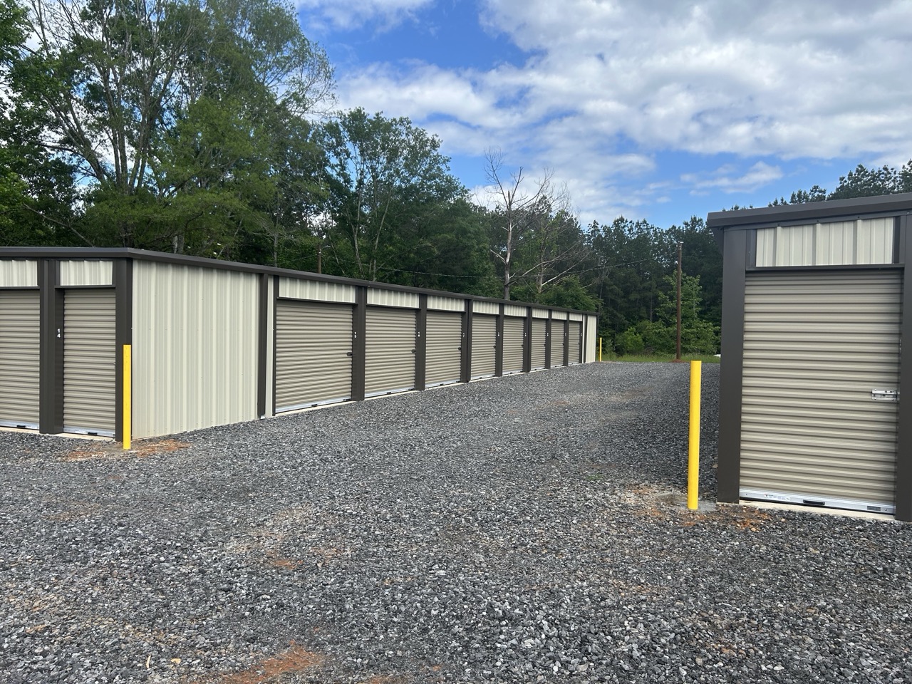 Wide gravel drive between drive-up storage buildings at Big Creek Mini Storage